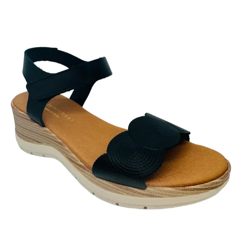 Sandals with unique heelsEric Michael HONEY Black Leather Sandal